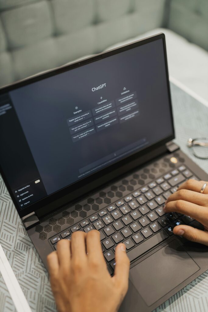 Virtual assistant using ChatGPT on a laptop to create content for a business client