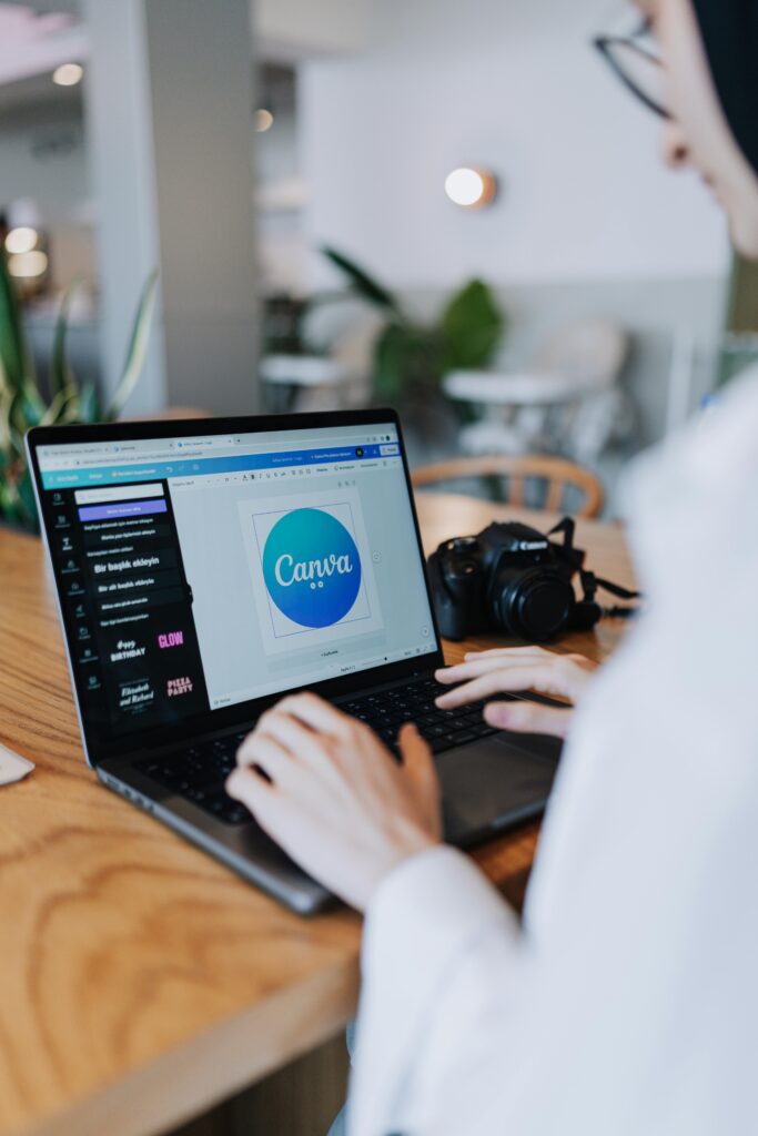 Virtual assistant designing social media graphics in Canva on a desktop screen for a business client