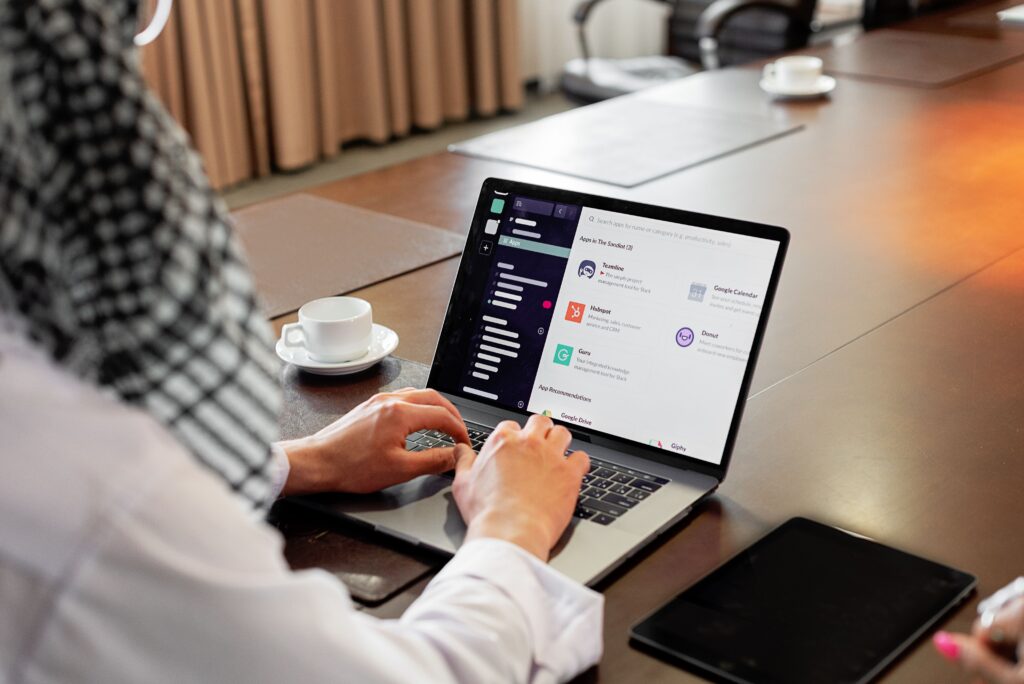 Virtual assistant managing admin and marketing tasks on a computer